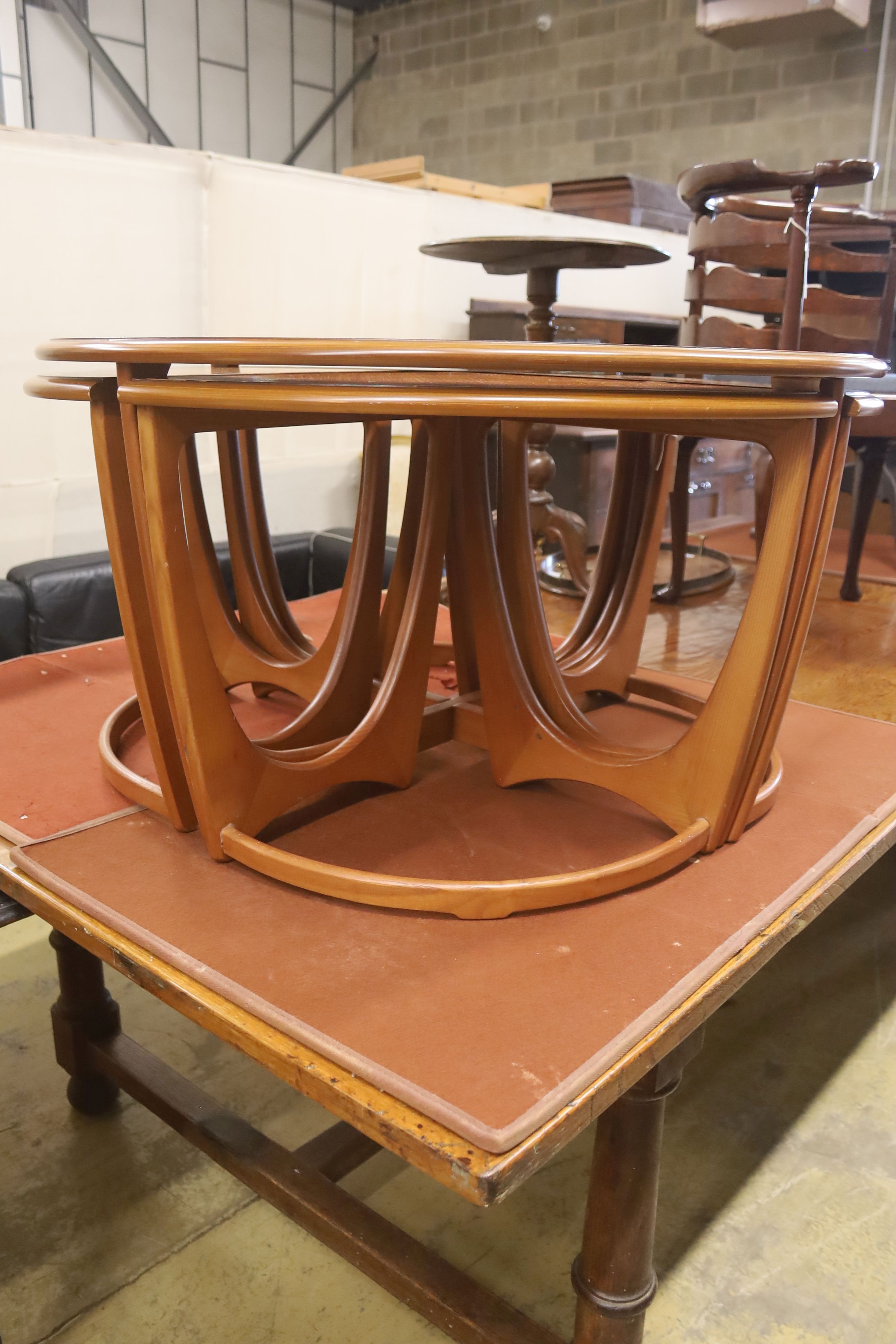 A nest of G plan teak tables, diameter 88cm, height 48cm